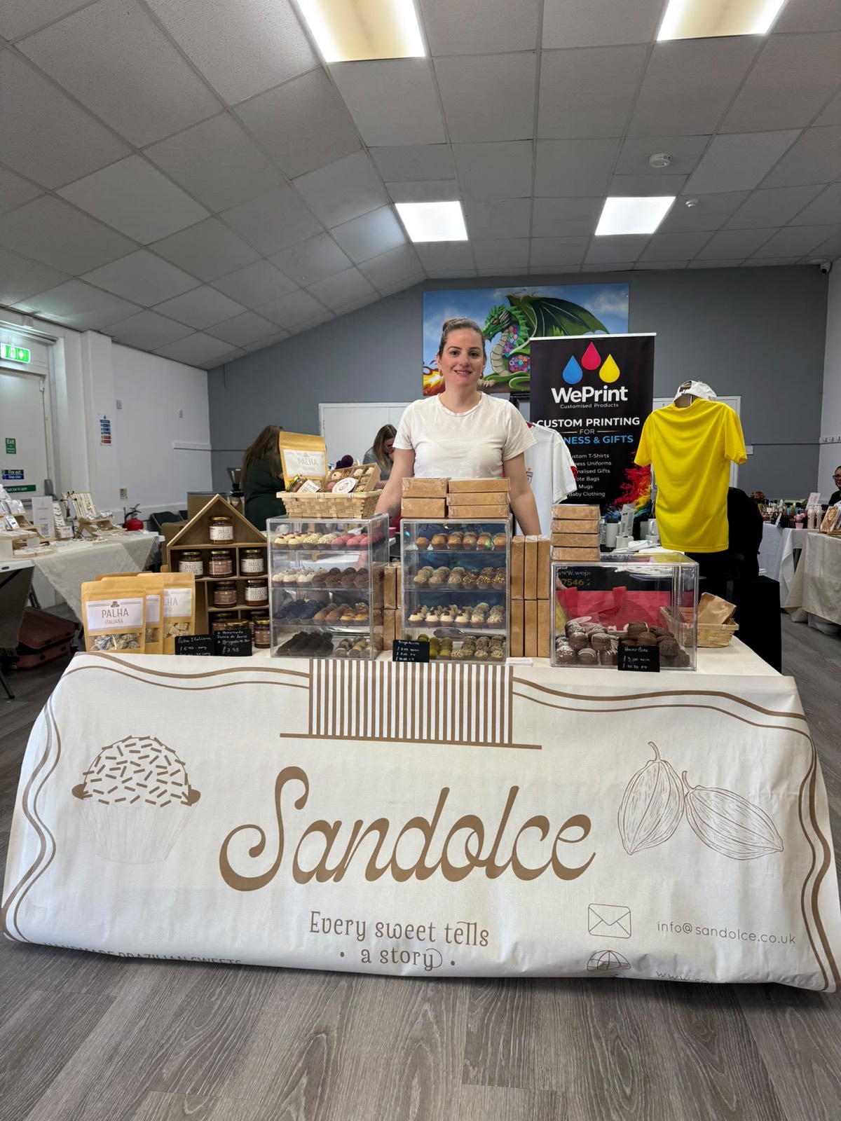 Sandolce sweets stall with its maker behind the table