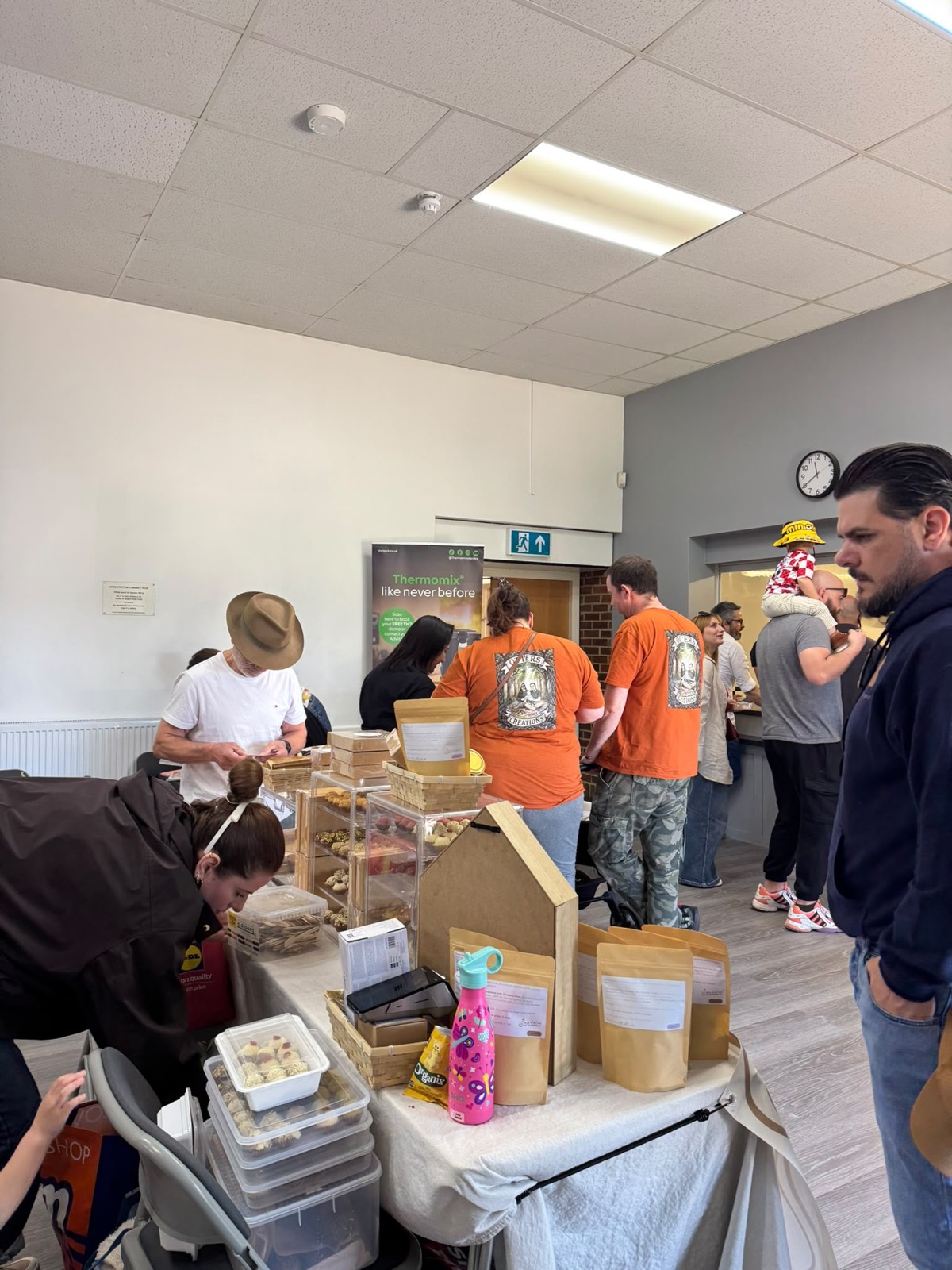 Visitors browsing handmade goods and treats