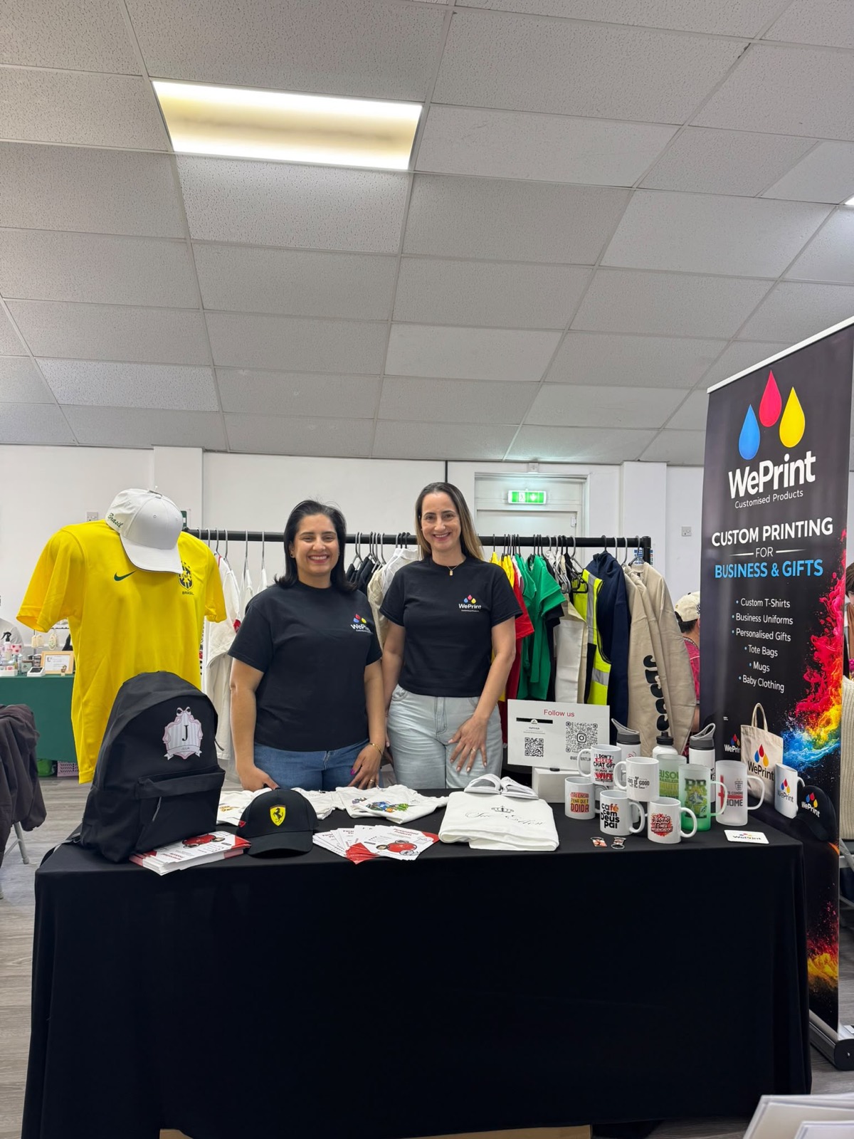 The WePrint team at their custom printing stand