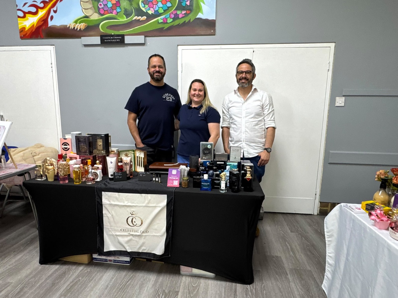 Exhibitors welcoming visitors at their fragrance table