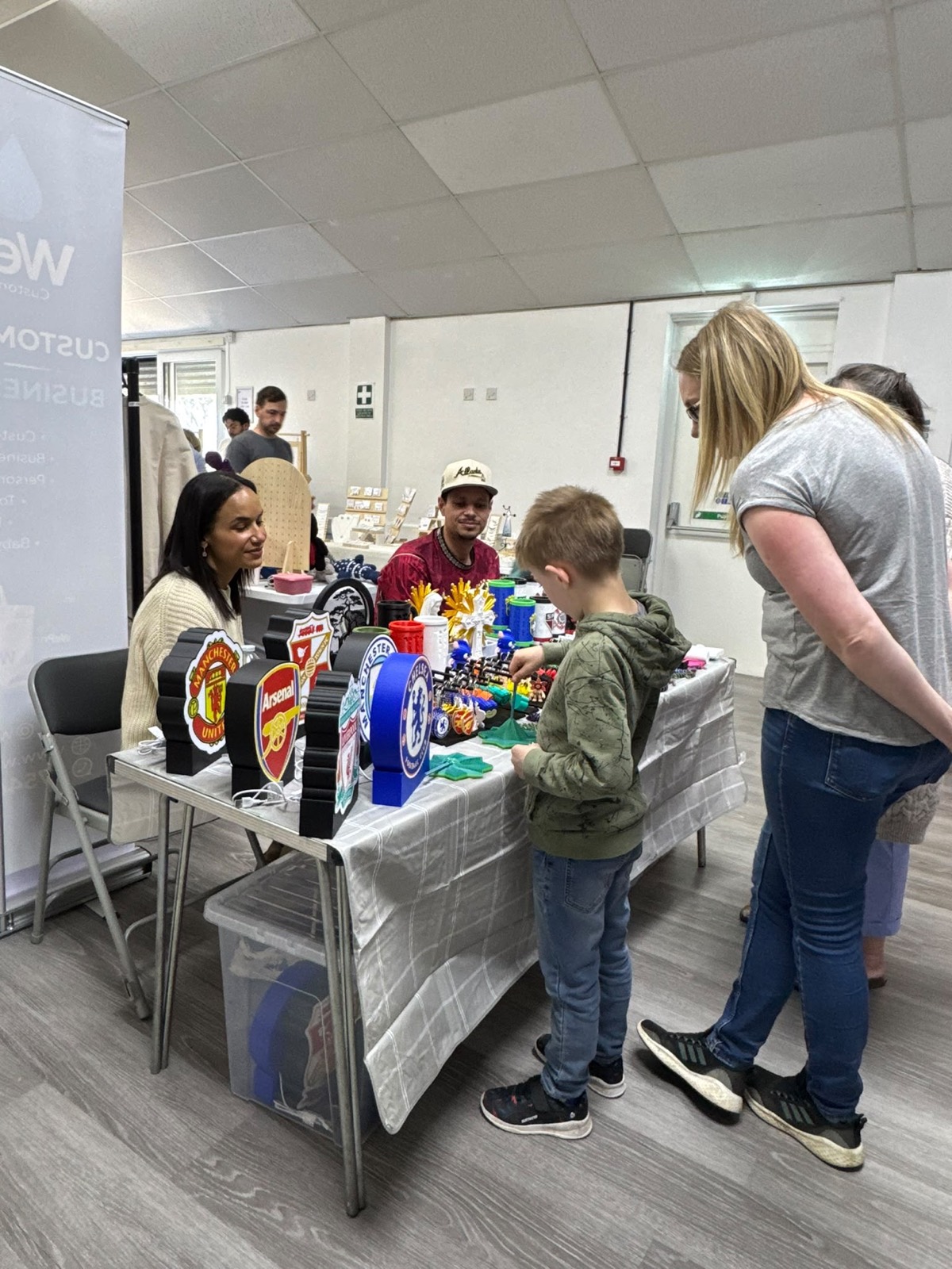 Families gathered around the kids' activity table